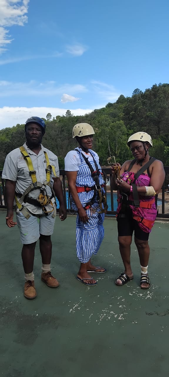 Tour guests in harnesses ready for ziplining adventure